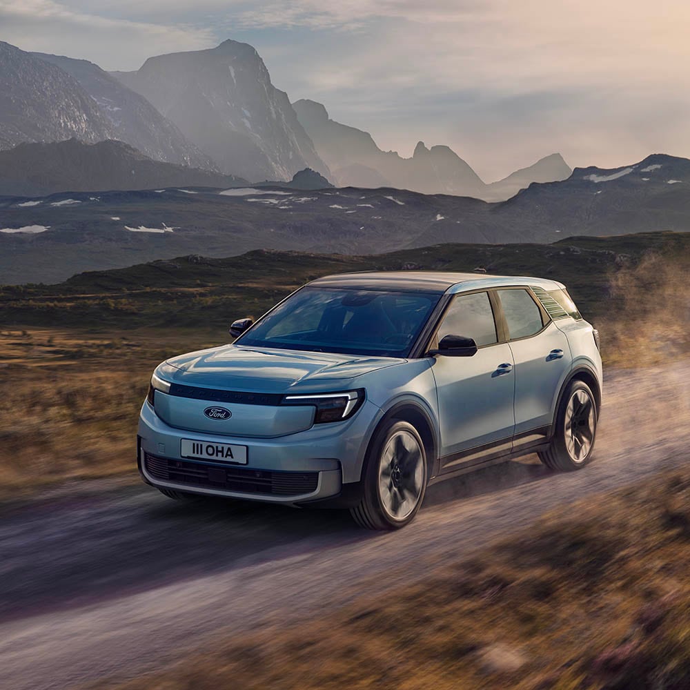 Ford Explorer driving in a mountainous landscape