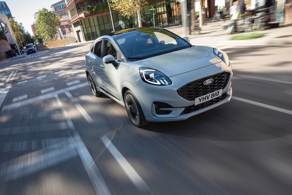 Silver Ford Puma cruising through town