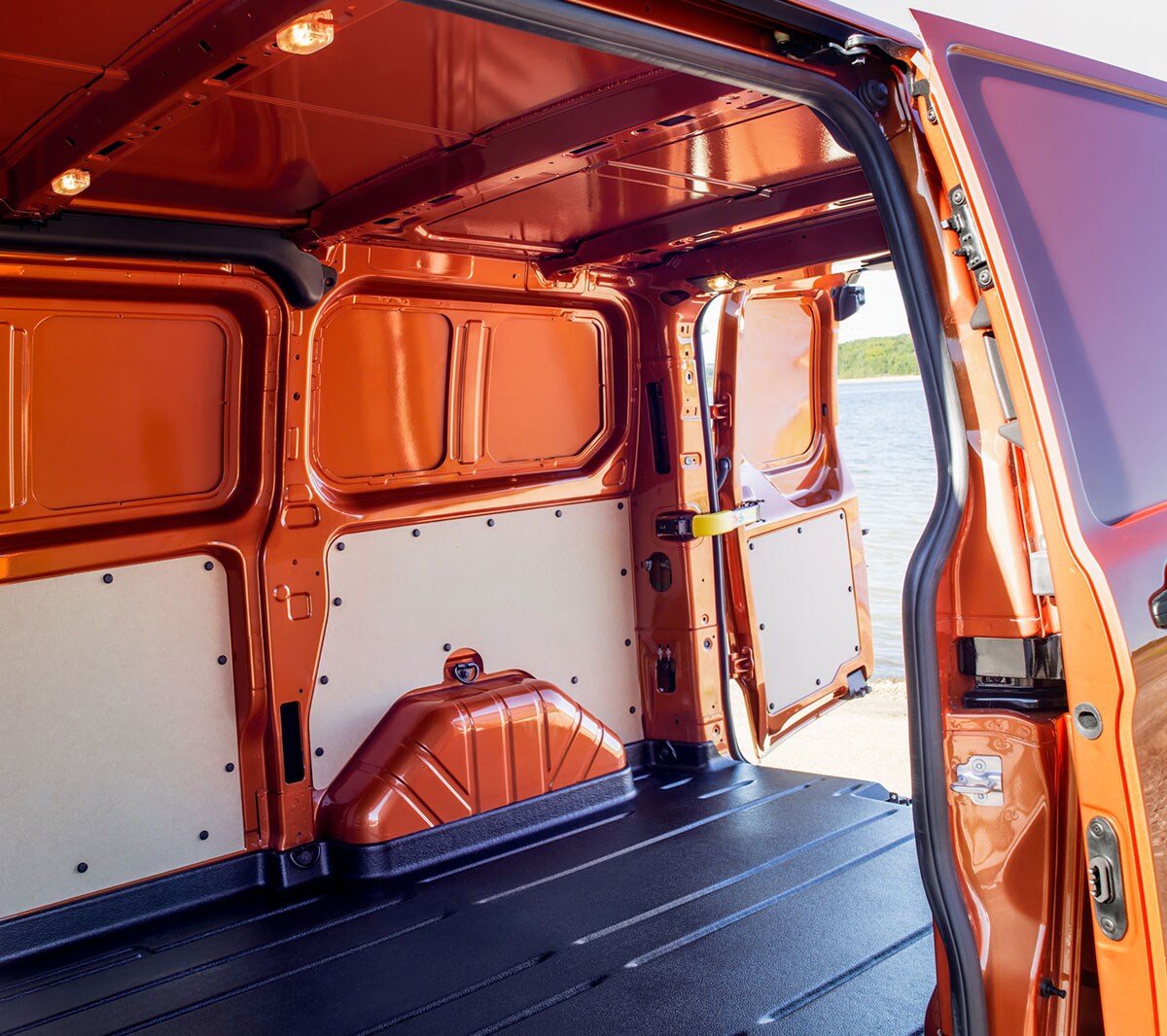 New Orange Ford Transit Custom open loadspace with side and rear doors
