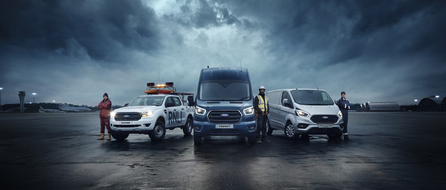 Ford range including Ranger, Transit Van and Transit Custom with people standing next to them